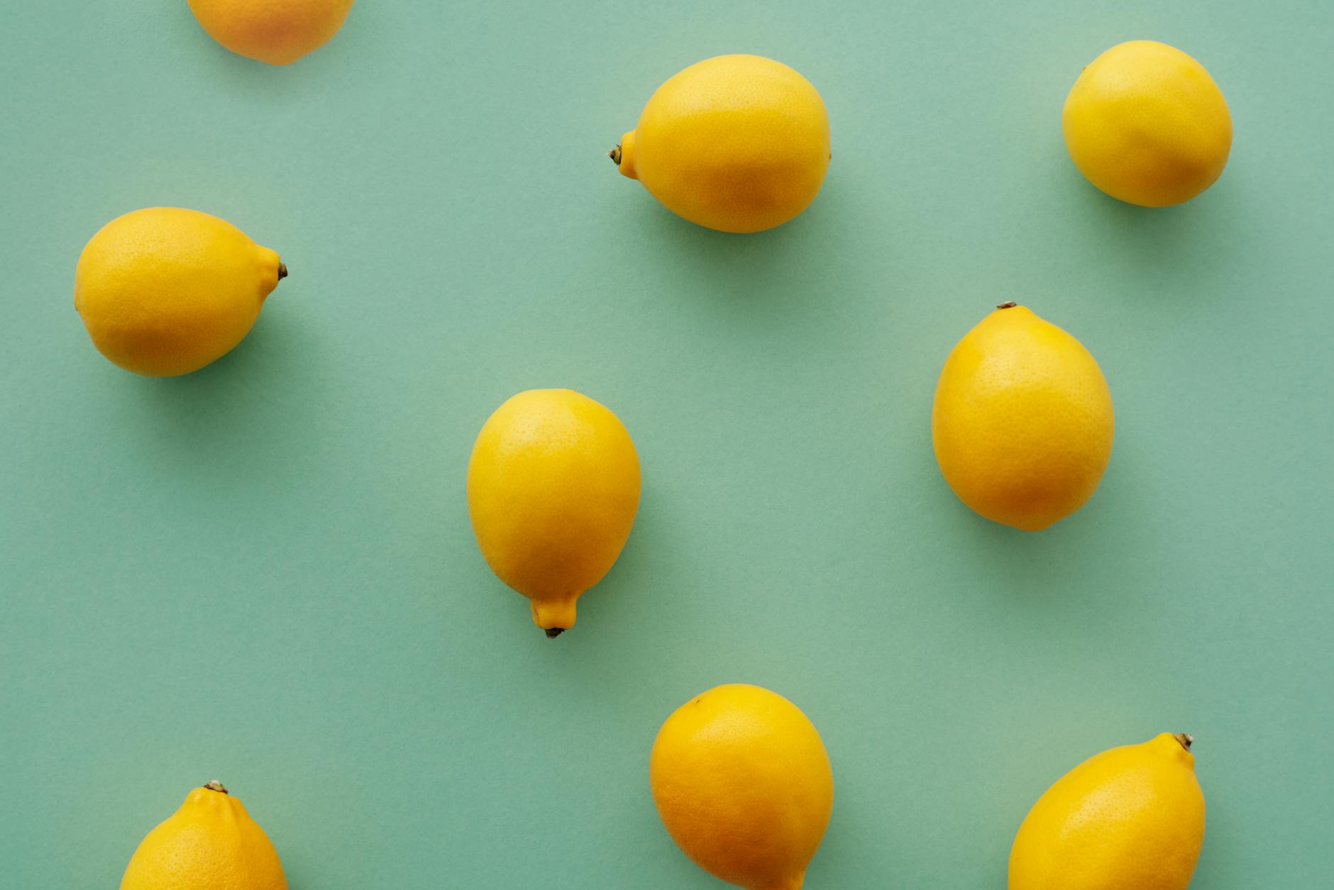 Fresh yellow lemons on a pastel background symbolizing renewal during relationship transitions