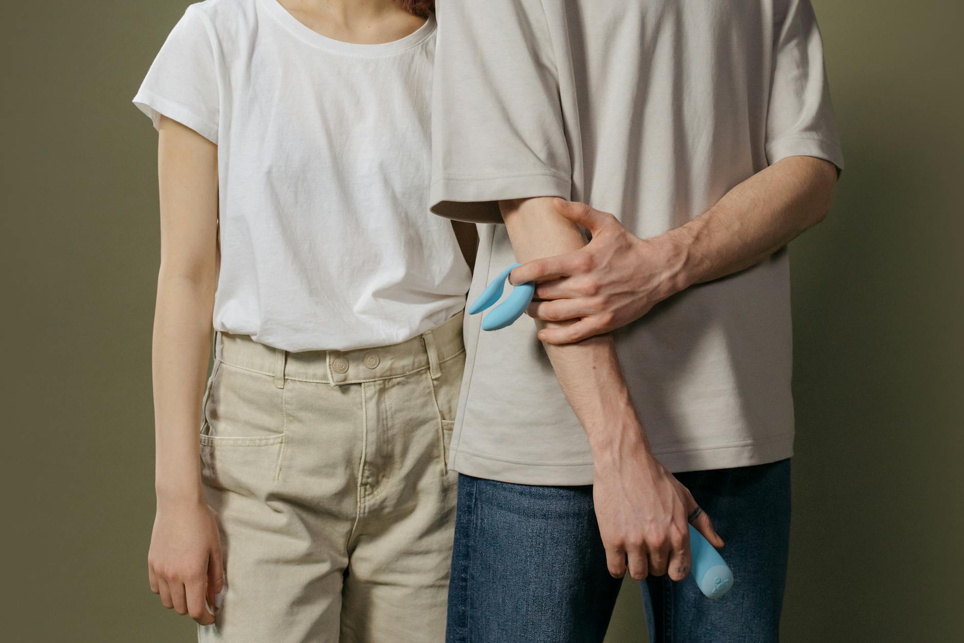 Hand holding a fresh lemon against a vivid yellow background, symbolizing brightness and renewal after a relationship ends